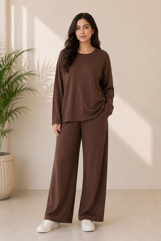 Chillpjs Noir Ease Co-Ord Set featuring a relaxed longline top and wide-leg trousers in soft brown fabric.