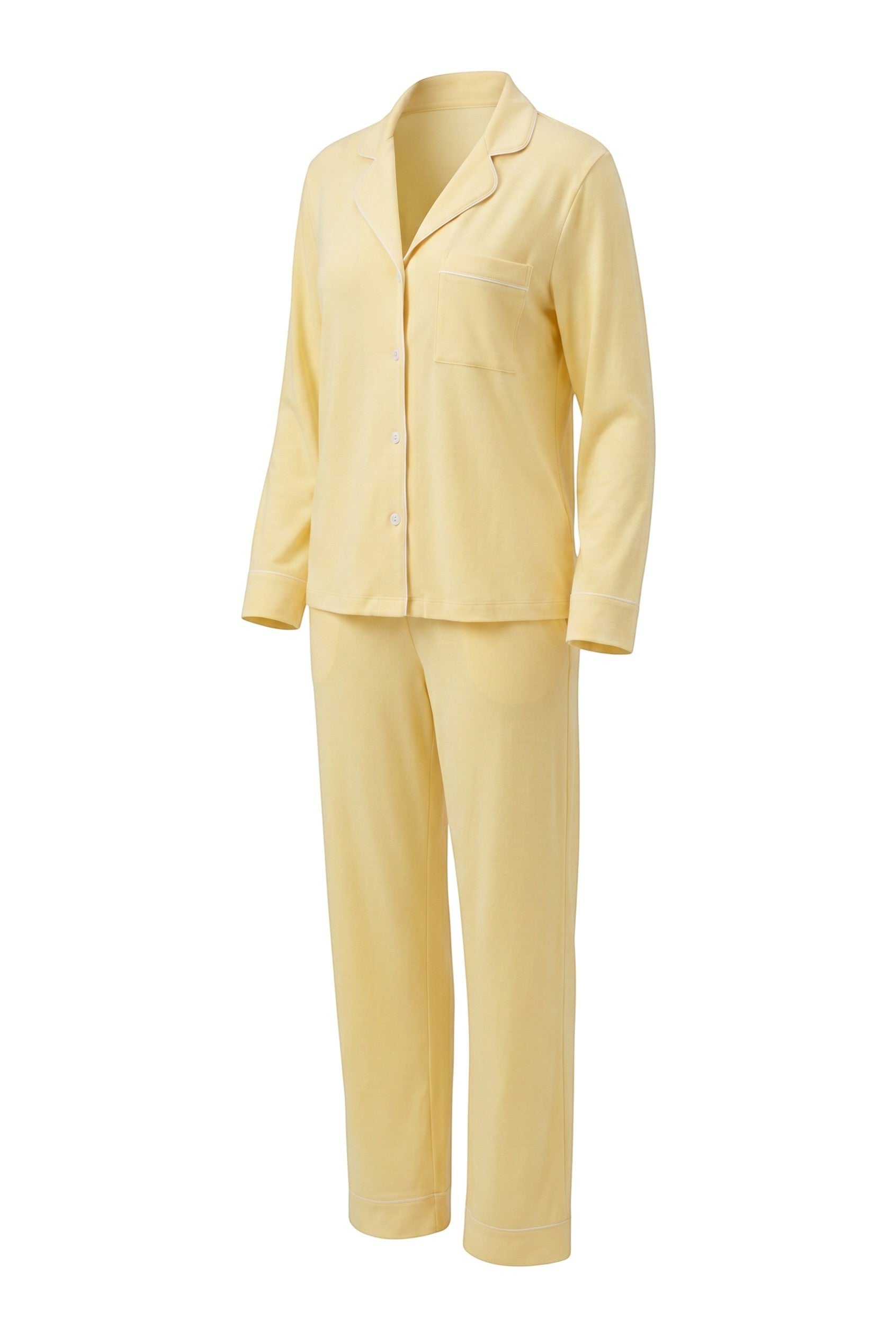 Chillpjs butter yellow soft linen pajama set featuring a long-sleeve button-down shirt and matching wide-leg pants.