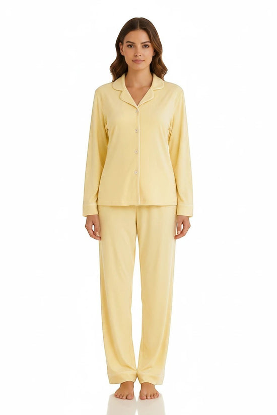 Model wearing a Chillpjs butter yellow soft linen pajama set with long sleeves, notch lapel collar, and wide leg pants.