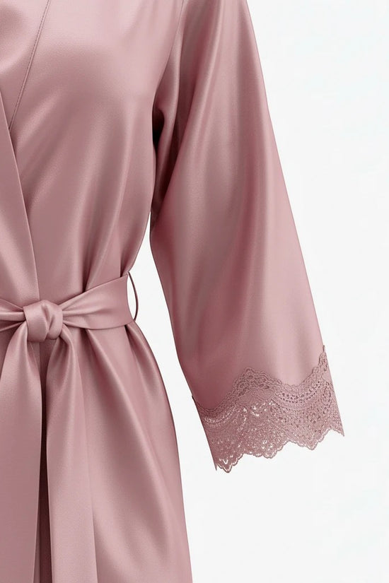 Chillpjs dusty rose satin robe with delicate lace trim on the sleeves and a matching tie-waist belt.