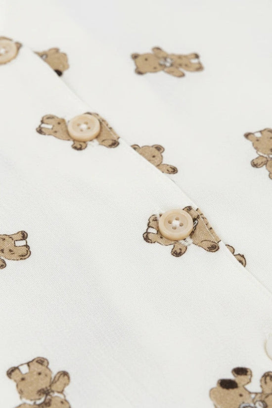 Chillpjs Honey Bear loungewear set in cream popcorn crinkle fabric with brown teddy bear print and button-down detail