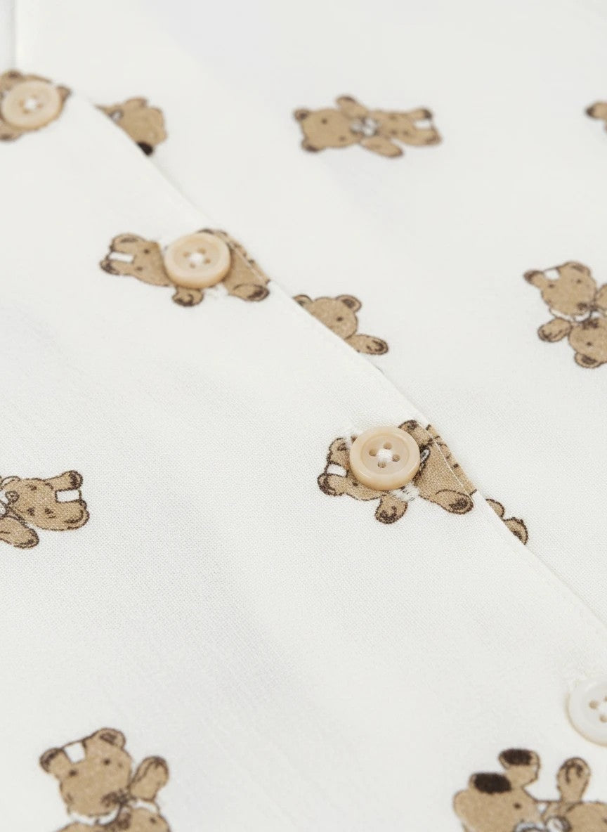 Chillpjs Honey Bear loungewear set in cream popcorn crinkle fabric with brown teddy bear print and button-down detail