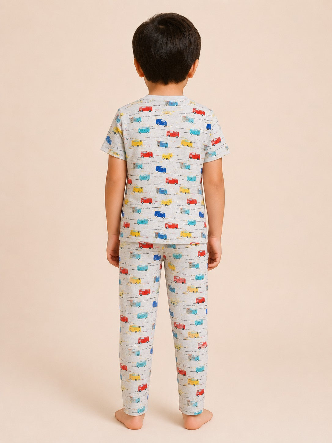 Chillpjs kids cotton pajama set in heather gray with colorful vintage car print, back view on a young boy.