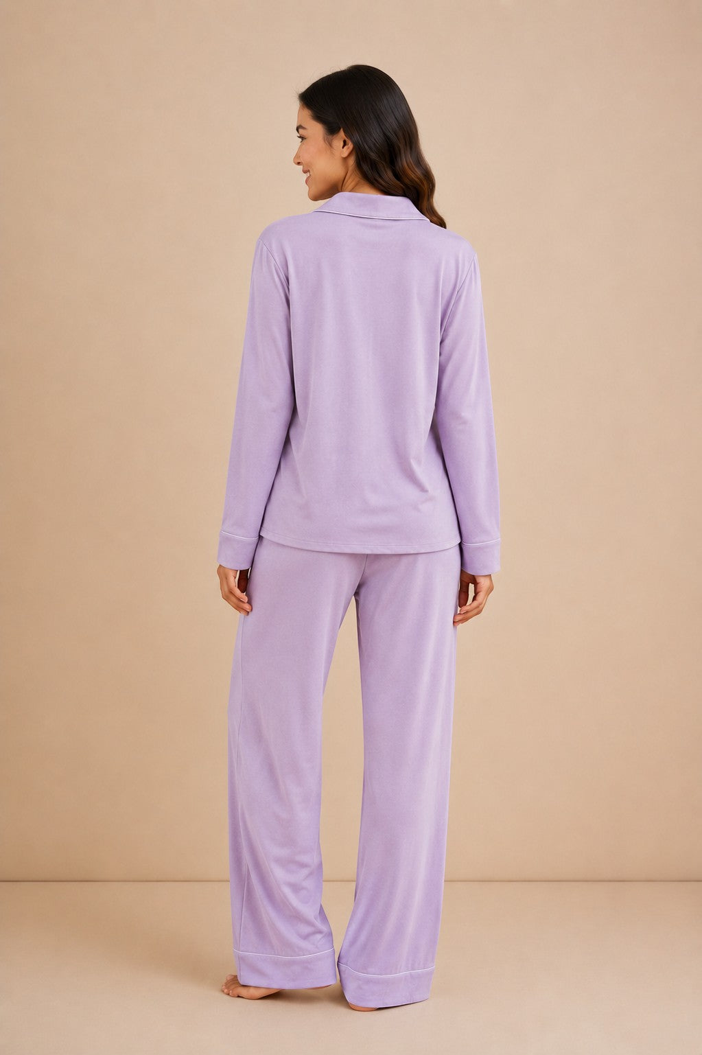 Chillpjs lavender soft linen pajama set with long sleeves and wide-leg pants worn by a woman, back view.