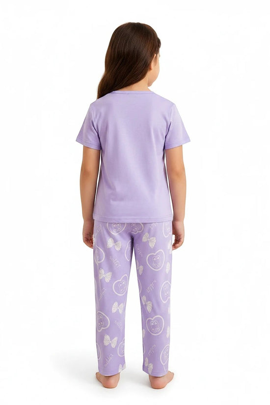 Chillpjs lavender cotton night suit with teddy bear and bow print worn by a young girl, back view