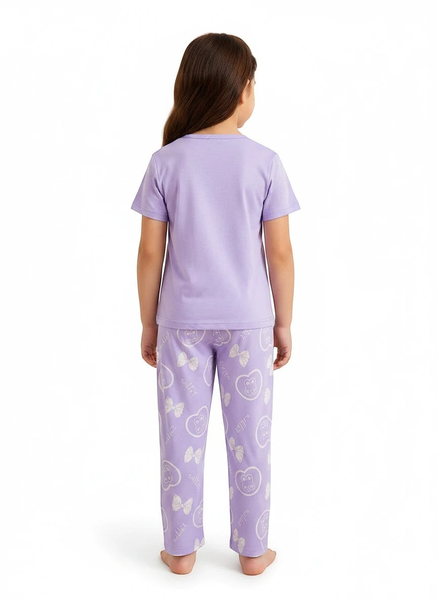 Chillpjs lavender cotton night suit with teddy bear and bow print worn by a young girl, back view