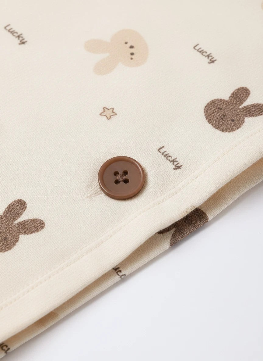 Chillpjs Lucky Bunny pajama set in sandstone cream popcorn crinkle fabric with brown button and mocha bunny print