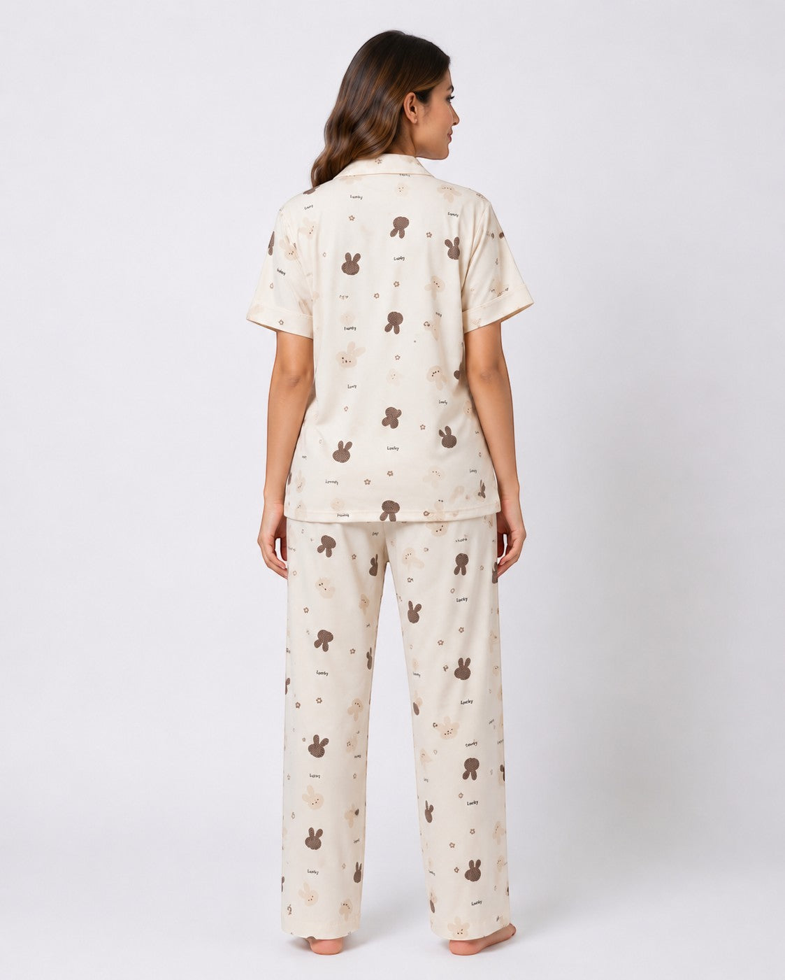 Chillpjs Lucky Bunny pajama set in sandstone cream with brown bunny print, featuring popcorn crinkle fabric, back view.