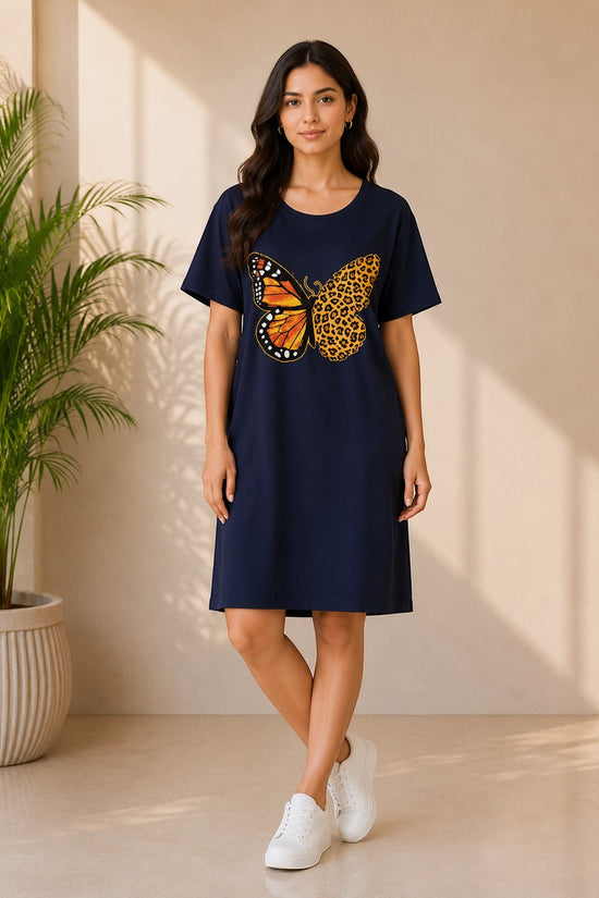Chillpjs navy oversized t-shirt dress featuring a butterfly and leopard print graphic on a woman in a bright room.