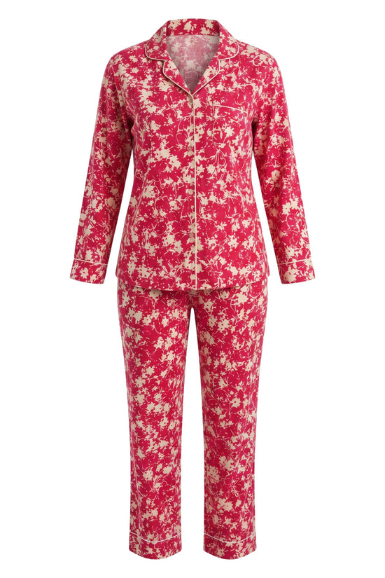 Chillpjs pink floral print button-down pajama set with long sleeves, notched collar, and contrast piping details.