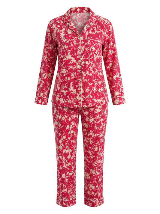 Chillpjs pink floral print button-down pajama set with long sleeves, notched collar, and contrast piping details.