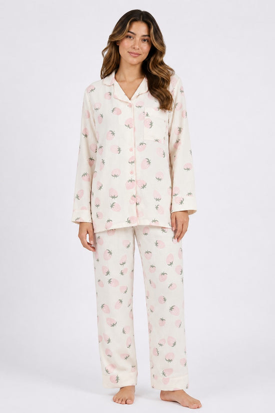 Model wearing Chillpjs Berry Blush full-sleeve pajama set in cream popcorn crinkle fabric with pink strawberry print.