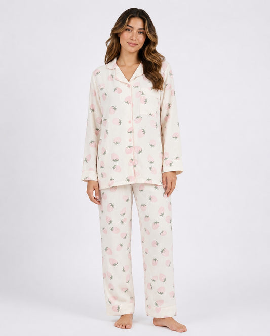 Model wearing Chillpjs Berry Blush full-sleeve pajama set in cream popcorn crinkle fabric with pink strawberry print.