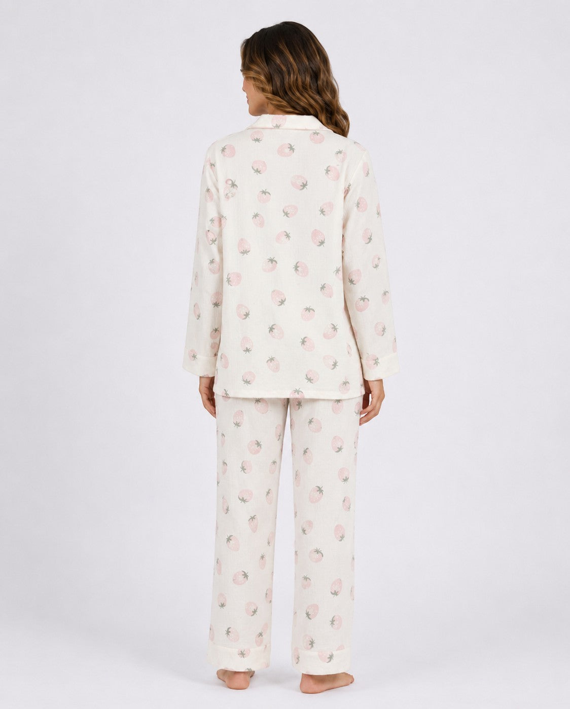 Back view of Chillpjs Berry Blush full-sleeve pajama set in cream with a pink strawberry print and popcorn texture.