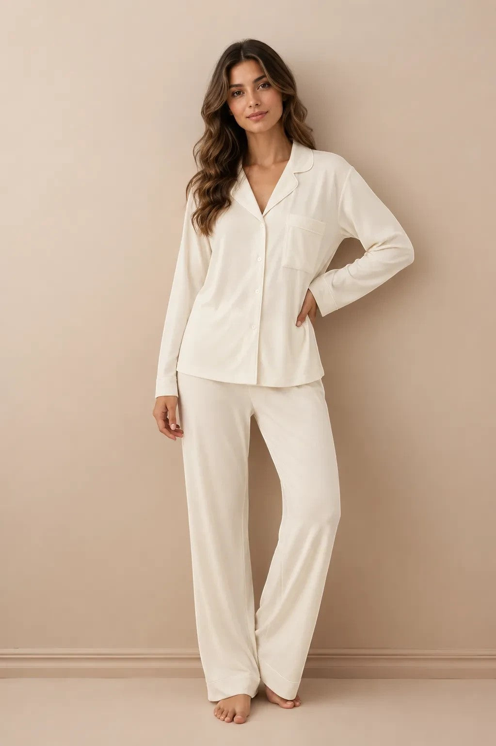 Woman wearing a Chillpjs white soft linen pajama set with a long-sleeve button-down shirt and wide-leg trousers.