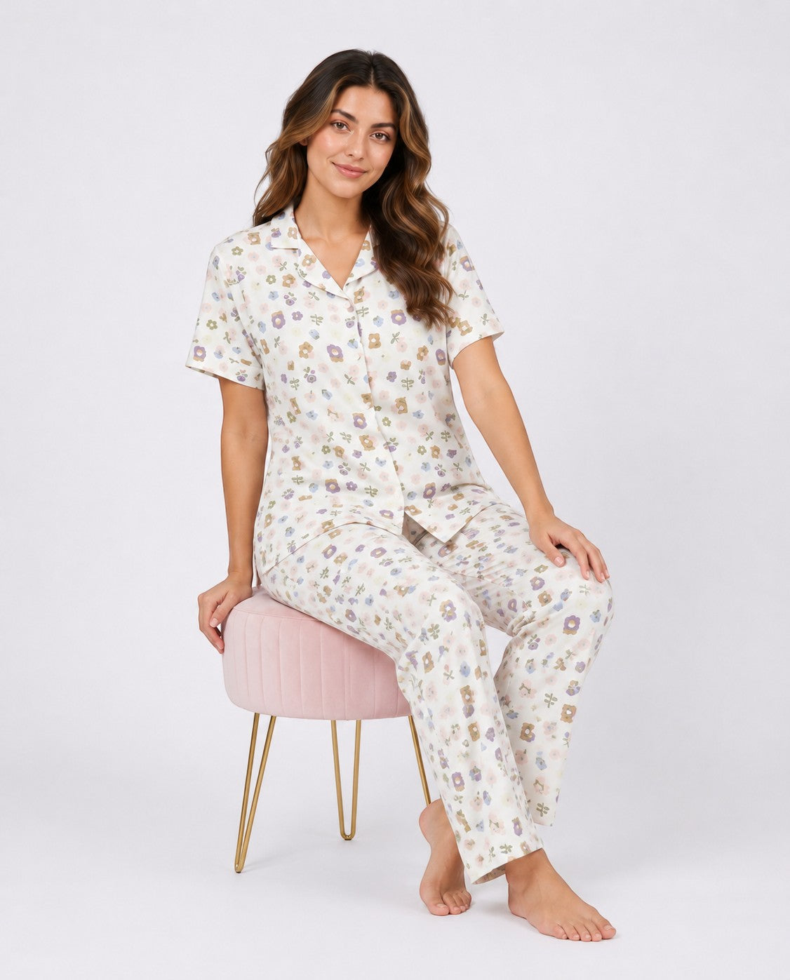 Model wearing Chillpjs wildflower popcorn crinkle pajama set with notched collar and floral print on cream fabric